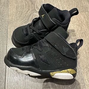 Jordan Black and Gold Sneakers with Cross-Straps
